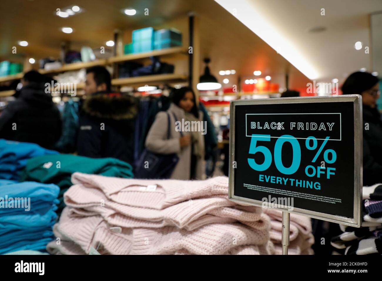 Holiday shoppers take part in early Black Friday shopping deals at the Gap  store on the