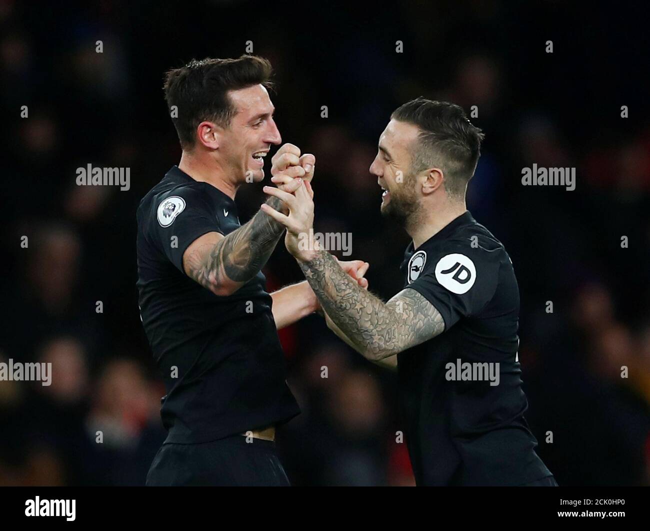 Soccer Football - Premier League - Arsenal v Brighton & Hove Albion - Emirates Stadium, London, Britain - December 5, 2019   Brighton & Hove Albion's Lewis Dunk and Shane Duffy celebrate after the match               REUTERS/Eddie Keogh    EDITORIAL USE ONLY. No use with unauthorized audio, video, data, fixture lists, club/league logos or 'live' services. Online in-match use limited to 75 images, no video emulation. No use in betting, games or single club/league/player publications.  Please contact your account representative for further details. Stock Photo