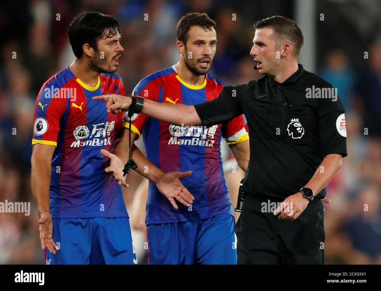 Soccer Football - Premier League - Crystal Palace v Liverpool - Selhurst Park, London, Britain - August 20, 2018  Crystal Palace's James Tomkins and Luka Milivojevic with referee Michael Oliver                    Action Images via Reuters/John Sibley  EDITORIAL USE ONLY. No use with unauthorized audio, video, data, fixture lists, club/league logos or 'live' services. Online in-match use limited to 75 images, no video emulation. No use in betting, games or single club/league/player publications.  Please contact your account representative for further details. Stock Photo