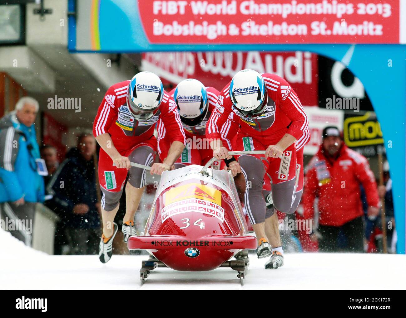 Switzerland's team pilot Beat Hefti (front R), Alex Baumann, Thomas  Lamparter and Juerg Egger start on the natural ice track during the first  run of the 4-men competition at the FIBT Bobsleigh