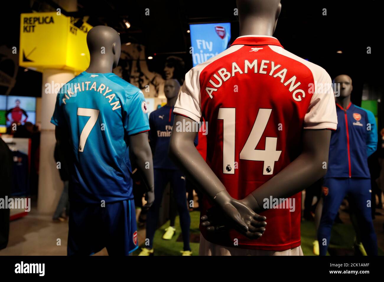 Soccer Football - Premier League - Arsenal vs Everton - Emirates London, Britain - February 3, 2018 Henrikh Mkhitaryan and Pierre-Emerick Aubameyang shirts on in the Arsenal club shop REUTERS/David