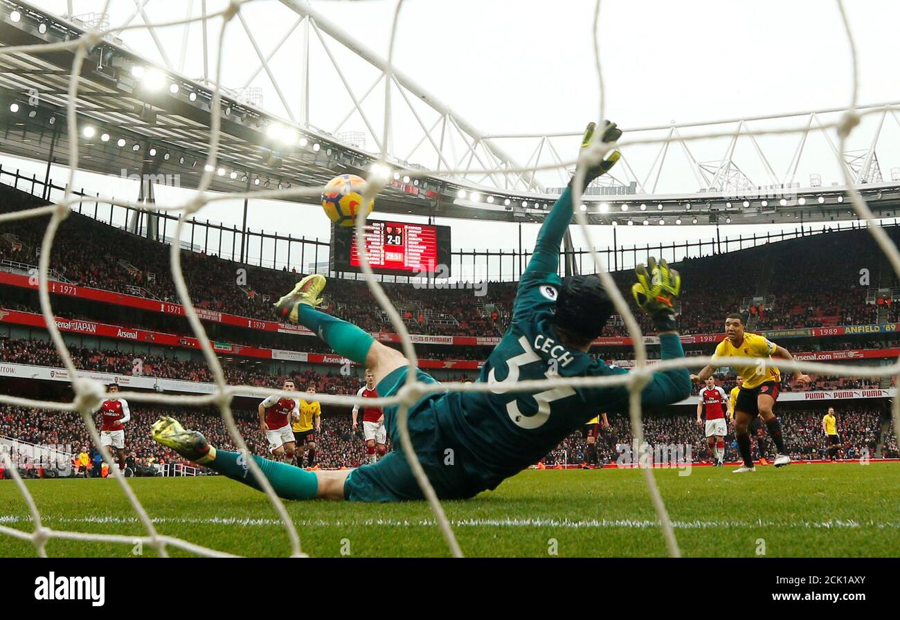 Soccer Football - Premier League - Arsenal vs Watford - Emirates Stadium, London, Britain - March 11, 2018   Arsenal's Petr Cech saves a penalty from Watford's Troy Deeney    REUTERS/Eddie Keogh    EDITORIAL USE ONLY. No use with unauthorized audio, video, data, fixture lists, club/league logos or 'live' services. Online in-match use limited to 75 images, no video emulation. No use in betting, games or single club/league/player publications.  Please contact your account representative for further details. Stock Photo