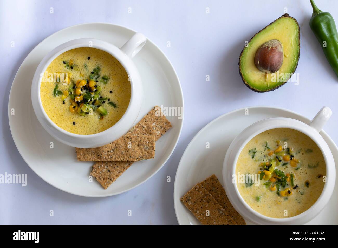 Chilled sweetcorn soup with avocado and coriander salsa Stock Photo Alamy