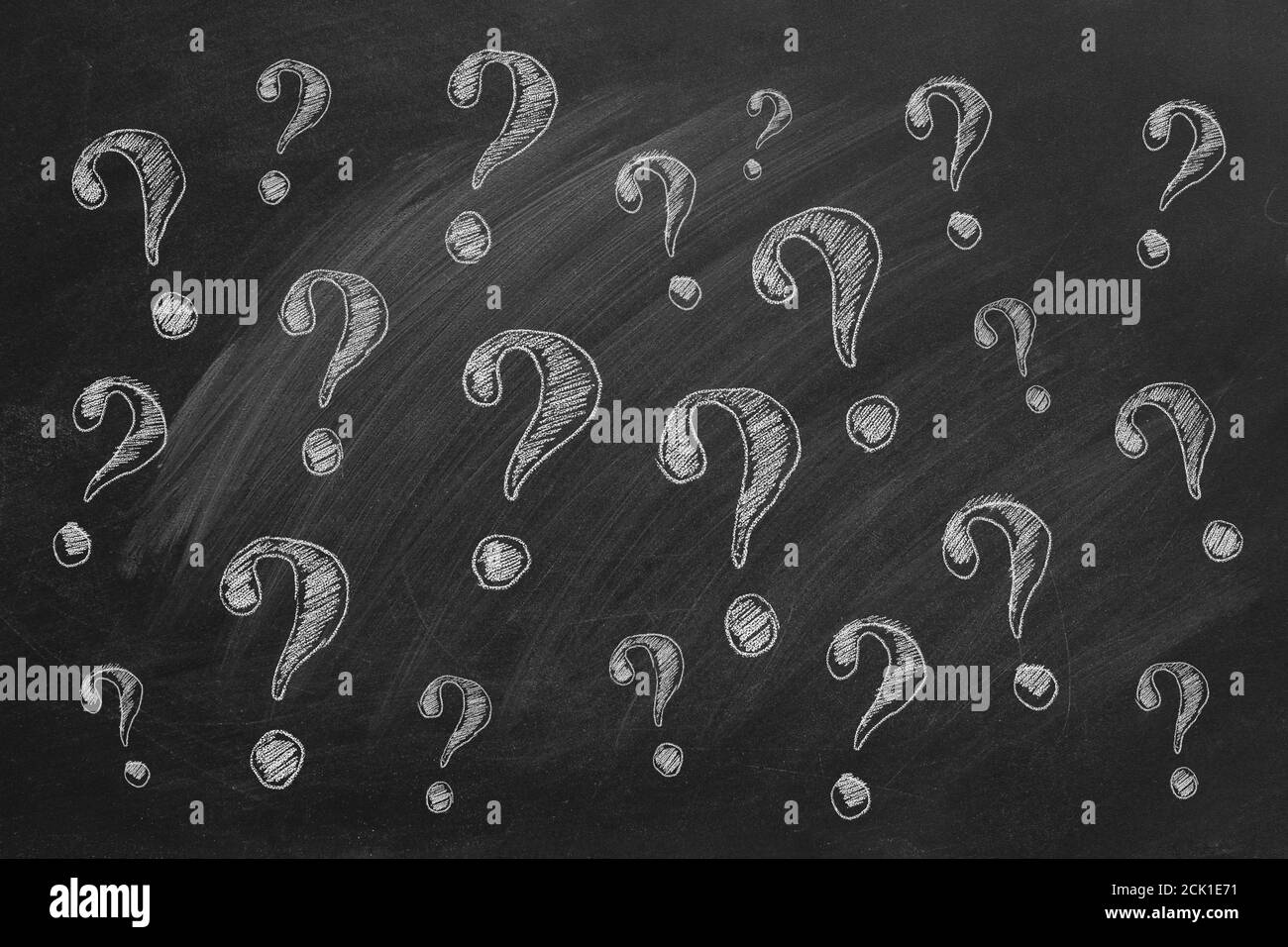 Question marks on blackboard Ask for help. FAQ concept.  Asking questions. Stock Photo