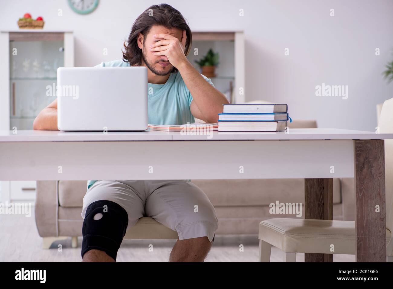 One Leg Student Young leg injured student studying at the home Stock Photo - Alamy
