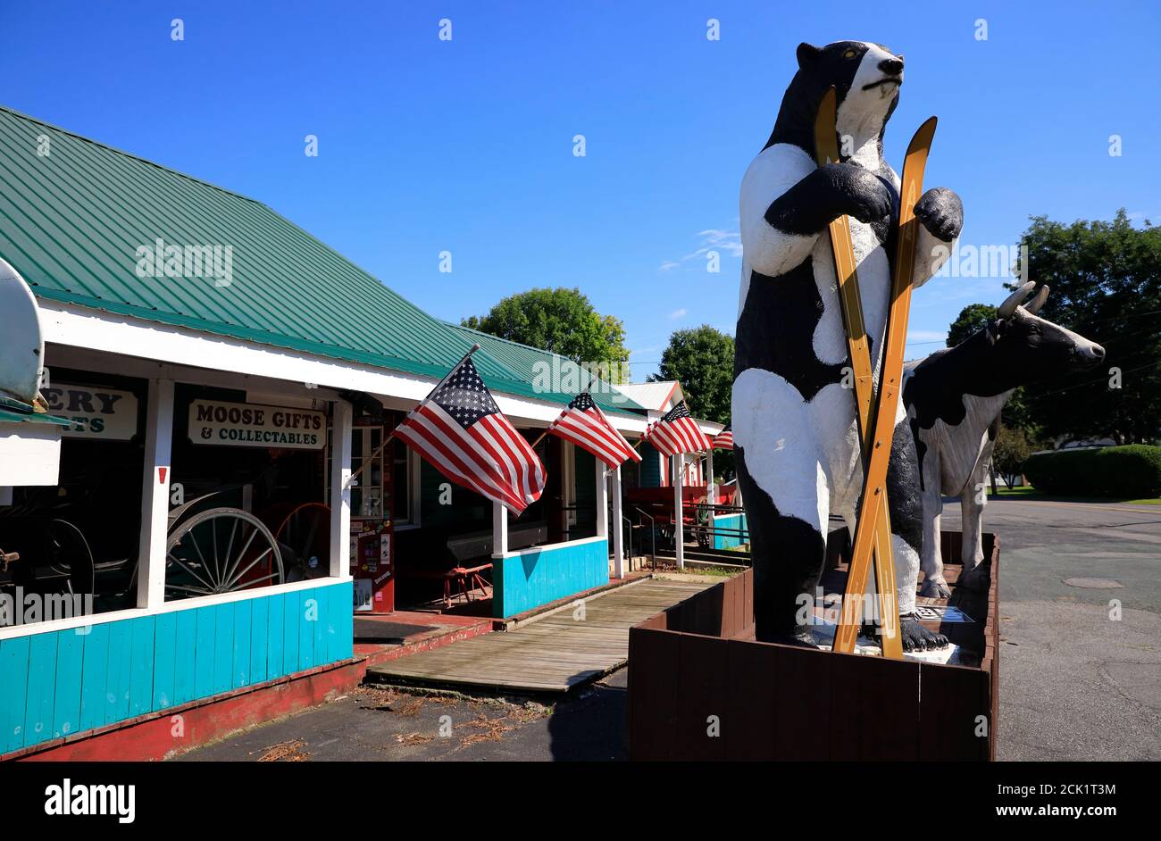 US flags and animal sculptures decorated Big Moose Deli & Country Store.Hoosick.New York.USA Stock Photo