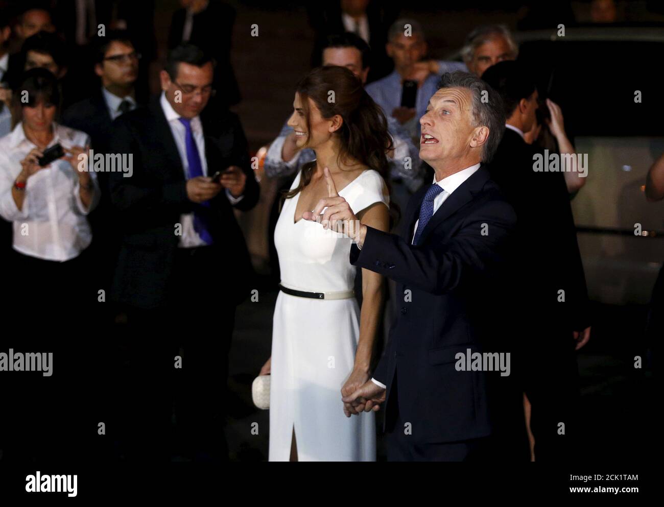 Argentina's President Mauricio Macri (R) gestures next to First Lady Juliana Awada after arriving for a gala at the Teatro Colon (Colon Theatre) in Buenos Aires December 10, 2015. Macri took office as Argentina's first non-Peronist president in more than a decade on Thursday, promising to end policies of leftist populism and revive the South American country's ailing economy. Macri began his 4-year term in a ceremony snubbed by his predecessor, Cristina Fernandez de Kirchner, following a rancorous argument over where the handover of power should take place.  REUTERS/Andres Stapff Stock Photo