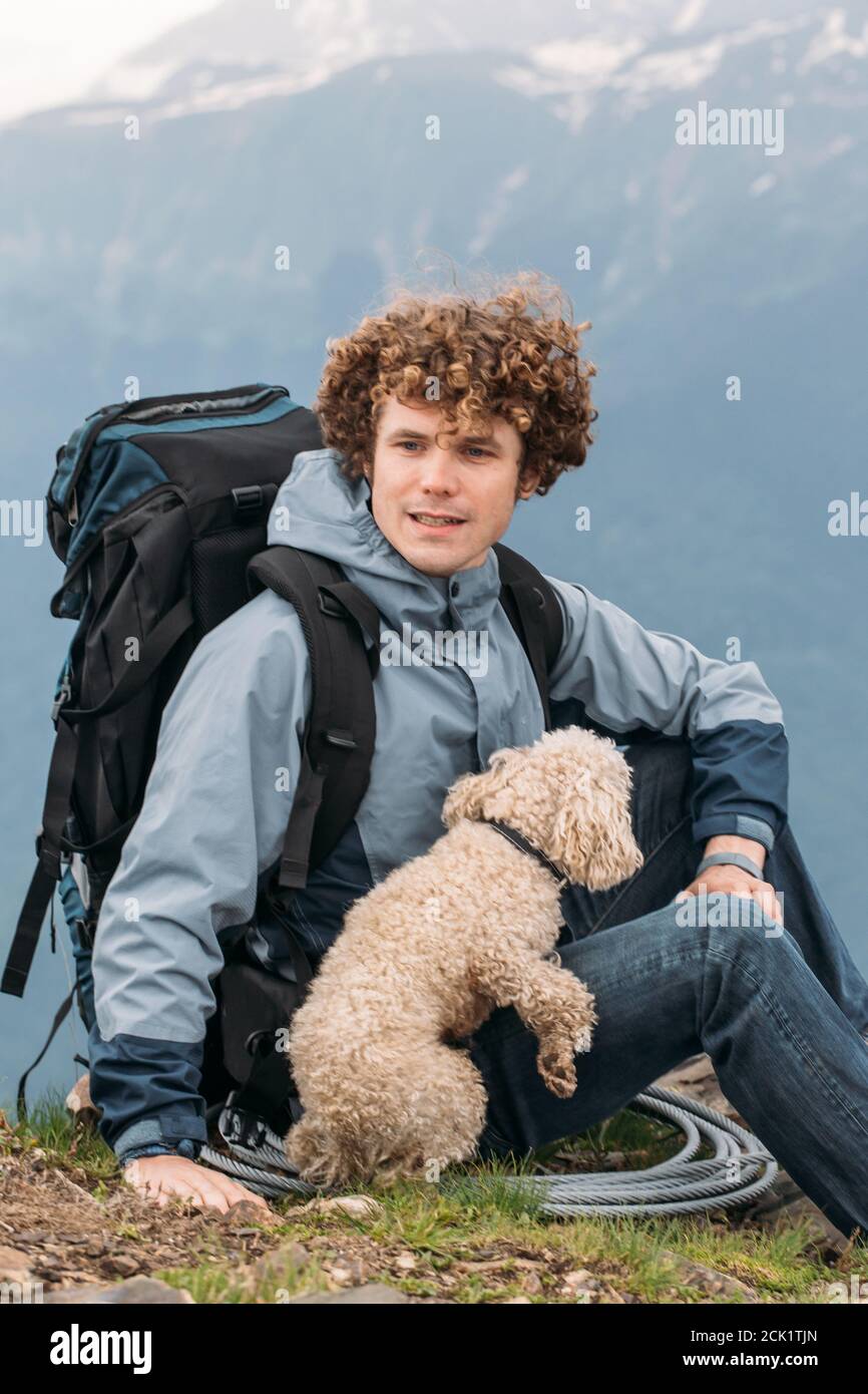 awesome ginger tourist and his pet have gone camping in the hill