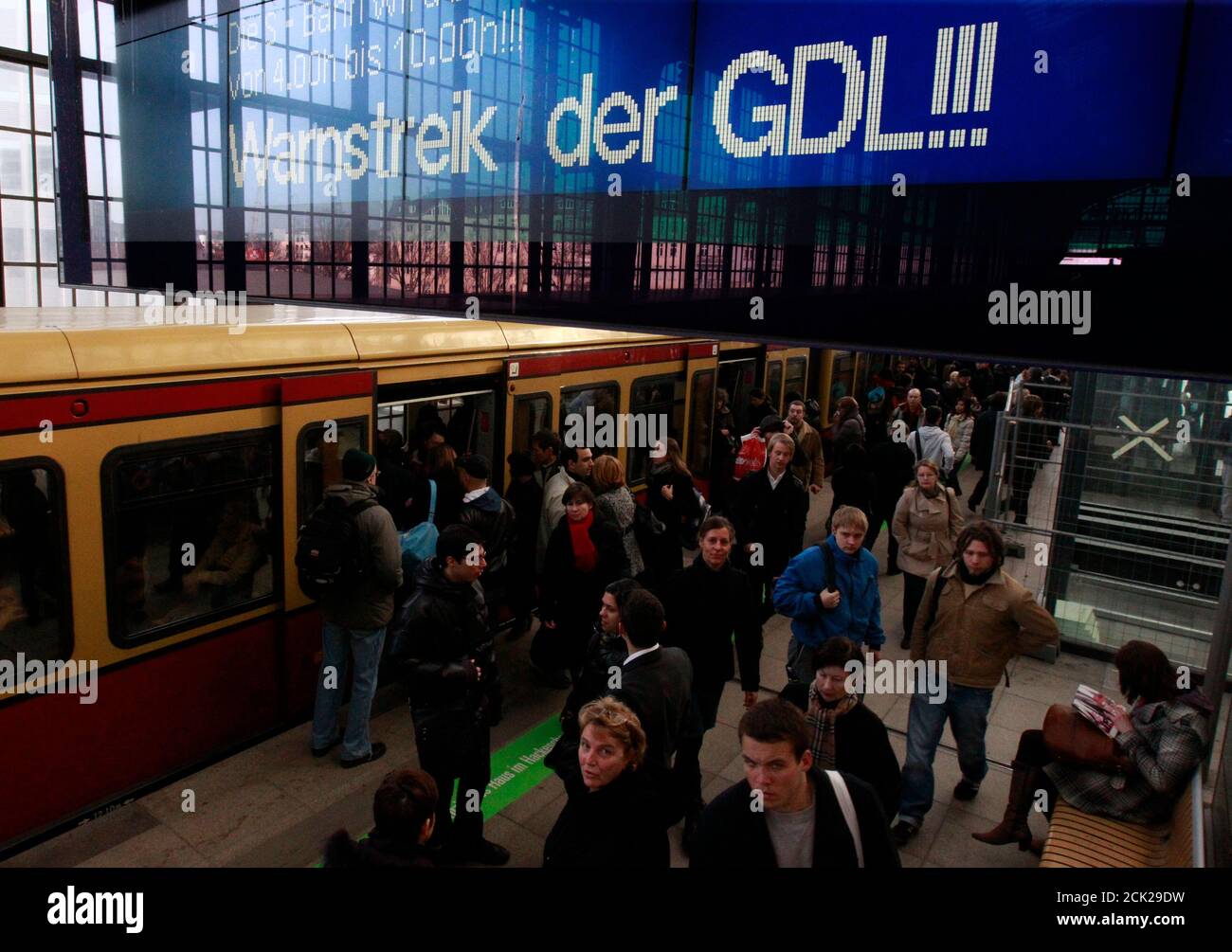 People enter and leave a S-Bahn commuter train in Berlin's Friedrichstrasse station during a train driver strike, March 10, 2011. German train drivers will launch strikes to disrupt freight transport across the country starting on Wednesday evening, and extend the action to passenger travel early on Thursday, their union said.   REUTERS/Thomas Peter  (GERMANY - Tags: EMPLOYMENT BUSINESS TRANSPORT IMAGES OF THE DAY) Stock Photo