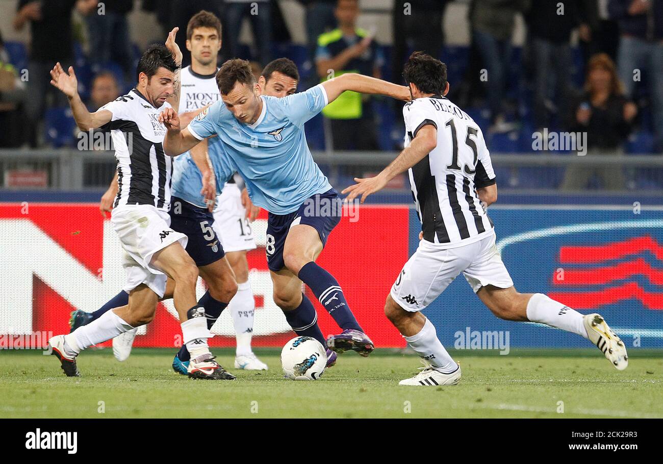 Ss Lazio S Libor Kozak C Is Challenged By Siena S Nicola Belmonte R And Andrea Rossi During Their Italian Serie A Soccer Match At The Olympic Stadium In Rome May 2 2012 Reuters Tony<script async src=