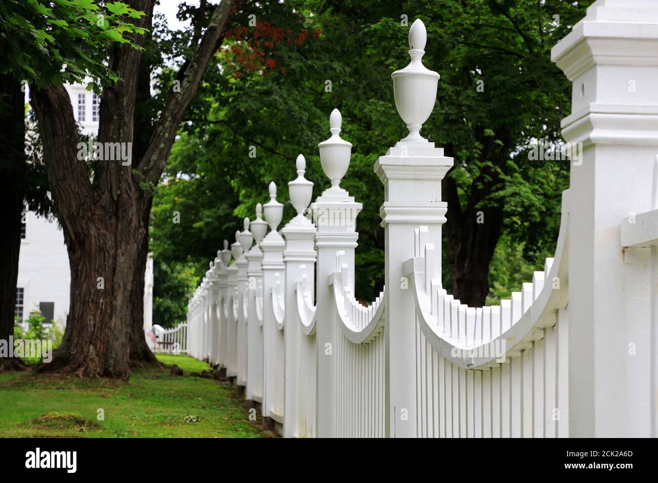 Curved white wooden fence of Old Bennington Cemetery.First Congregational church of Bennington.Bennington.Vermont.USA Stock Photo