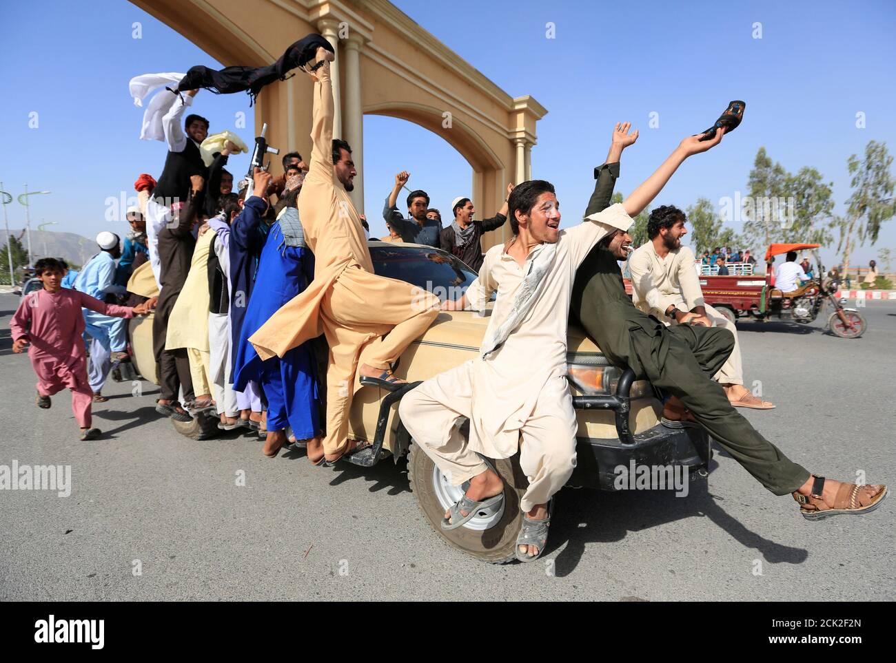 People celebrate ceasefire in Rodat district of Nangarhar province, Afghanistan June 16, 2018.REUTERS/Parwiz Stock Photo