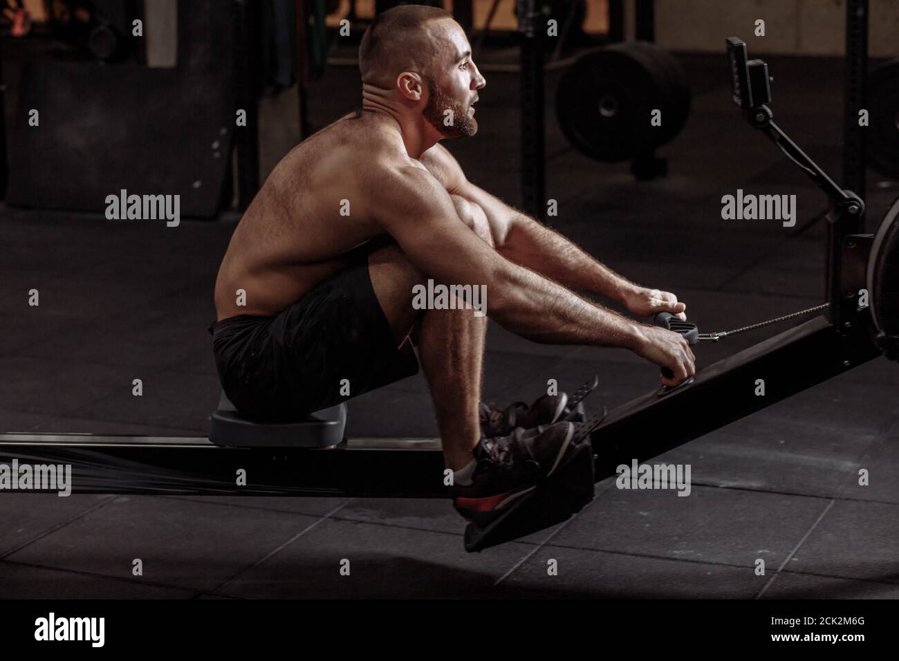 effective workout for perfect abs. handsome man is doing exercise for six pack. closeup side view photo Stock Photo