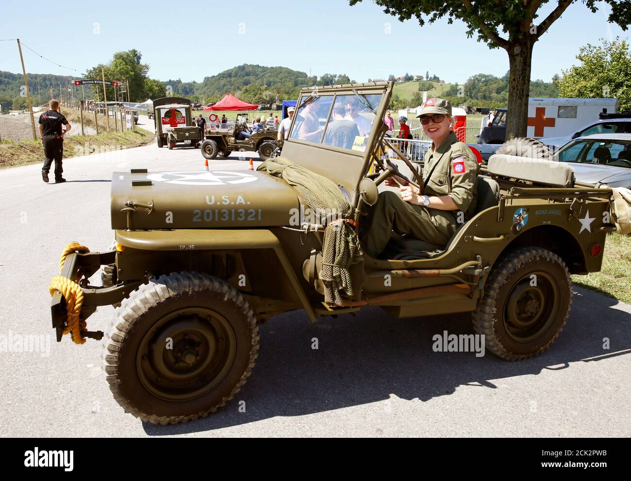 A participant arrives in a World War II U.S. Willys Jeep at the 8th  Convoy-to-Remember meeting in the village of Birmenstorf, Switzerland  August 9, 2019. REUTERS/Arnd Wiegmann Stock Photo - Alamy