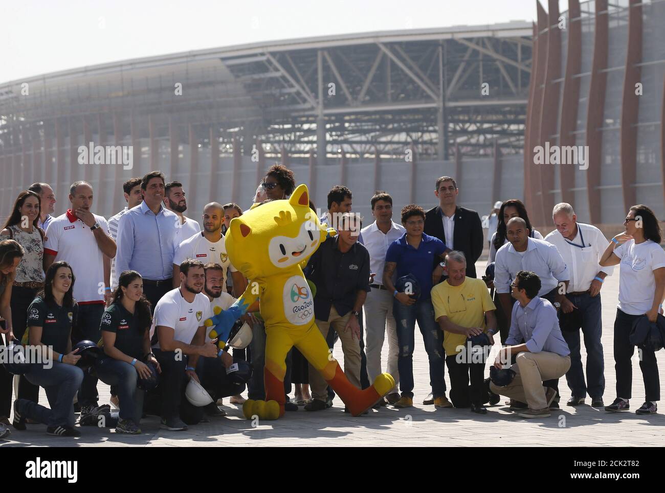 Rio de Janeiro mayor Eduardo Paes (C) poses for pictures next to the Rio 2016 Olympic mascot Vinicius and current and former Brazilian Olympians at the Olympic Park in Rio de Janeiro, Brazil, August 5, 2015. Rio de Janeiro started the one year countdown to host the Rio 2016 Olympic Games on Wednesday. REUTERS/Sergio Moraes Stock Photo