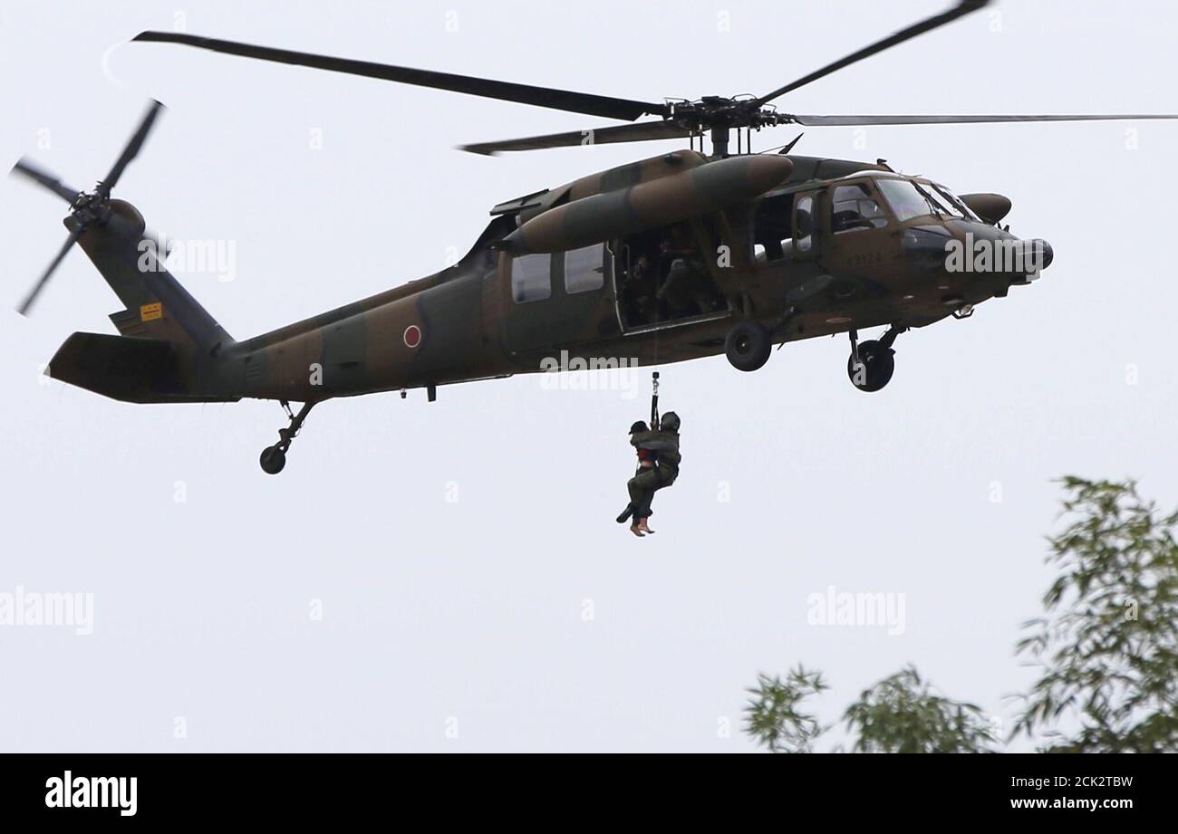 A Resident L Is Rescued By A Japan Self Defense Force Jsdf Helicopter At A Residential Area Flooded By The Kinugawa River Caused By Typhoon Etau In Joso Ibaraki Prefecture Japan September 10