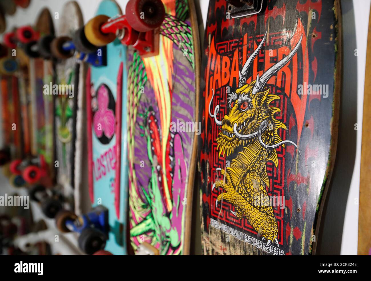 Boards are pictured at the "double tails and punk graphics" section of the  Geneva Skateboard Museum,