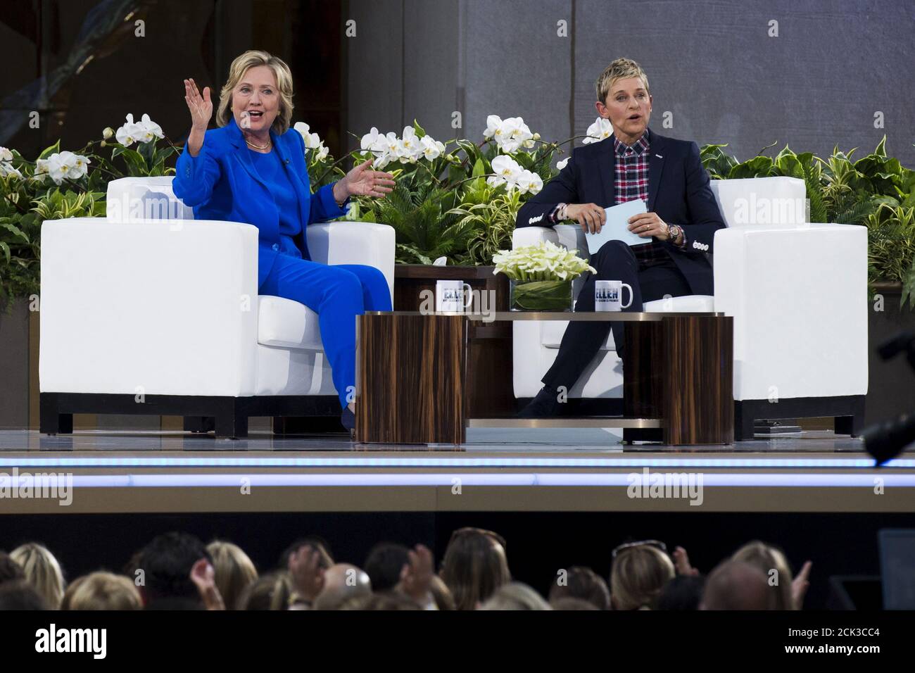 U.S. Democratic presidential candidate Hillary Clinton speaks with  television host Ellen DeGeneres during a taping of 