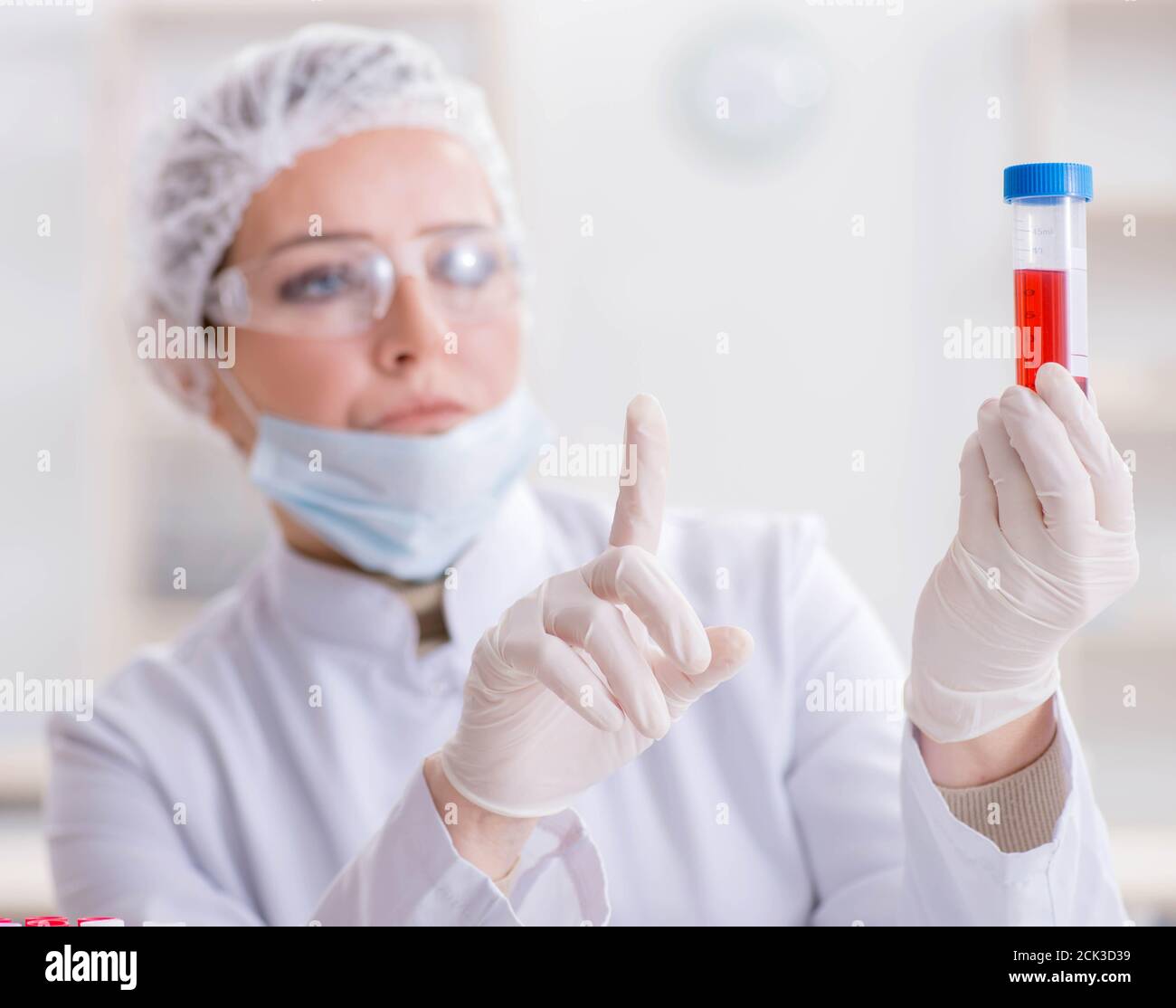 The woman doctor checking blood samples in lab Stock Photo Alamy