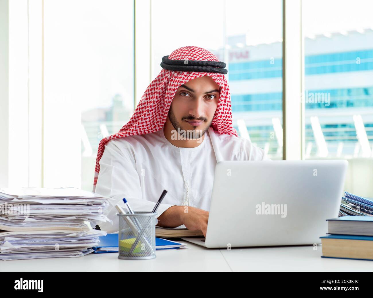 The arab businessman working in the office Stock Photo - Alamy