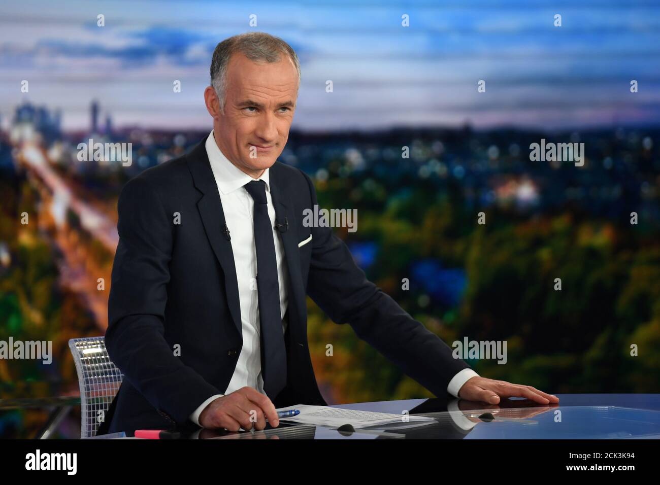 French TV host Gilles Bouleau looks on as he attends a "public order"  announcements by French Prime Minister Edouard Philippe, in the face of  recent violent situations involving the Yellow Vest 'Gilets