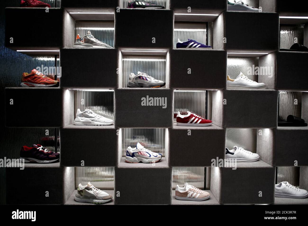 Adidas sneakers are displayed for sale at the Galeries Lafayette department  store on the Champs-Elysees avenue in Paris, France, April 11, 2019.  REUTERS/Benoit Tessier Stock Photo - Alamy
