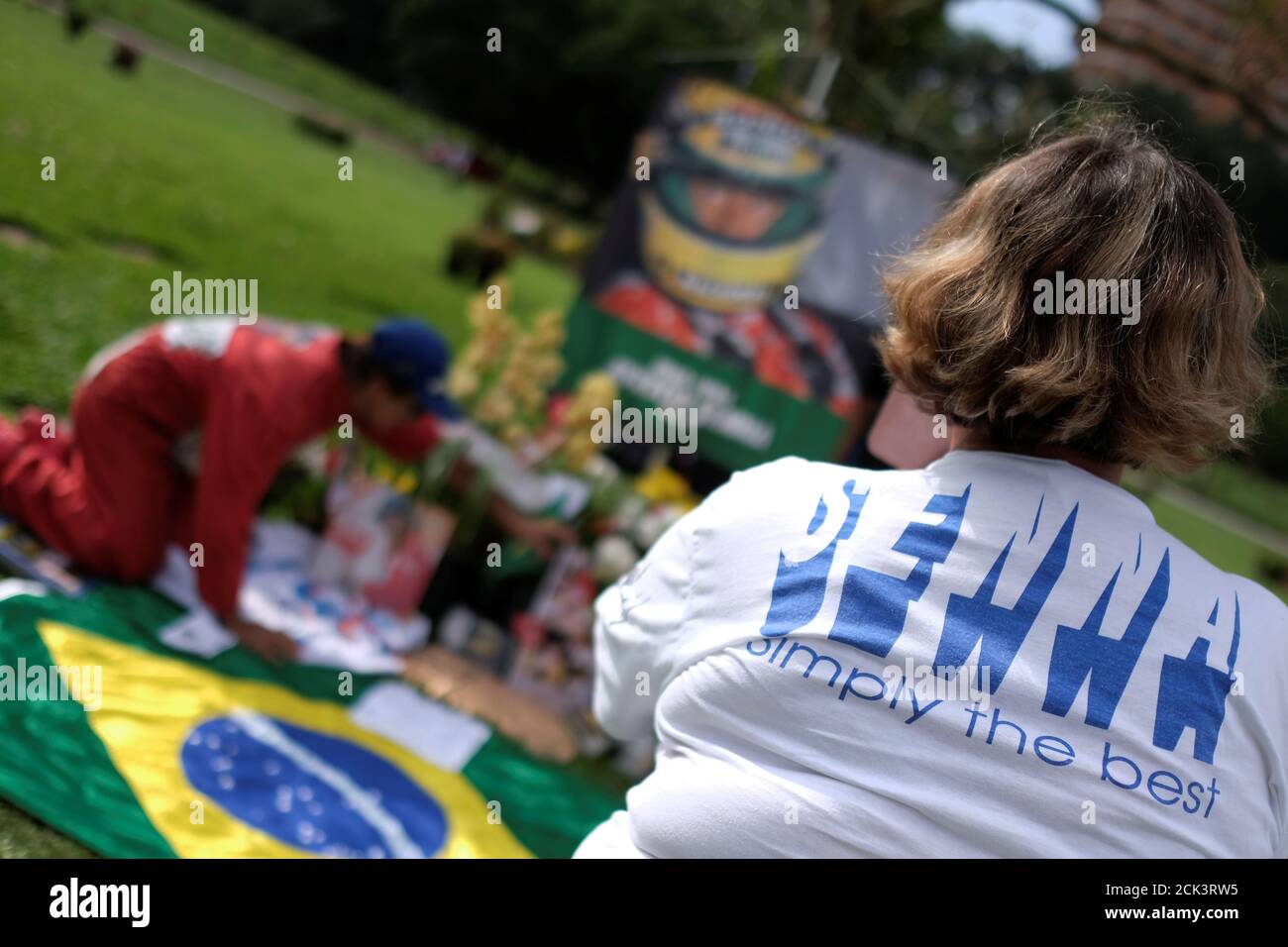 A fan taking a picture at Ayrton Senna&rsquo;s grave on the 25th anniversary of his death