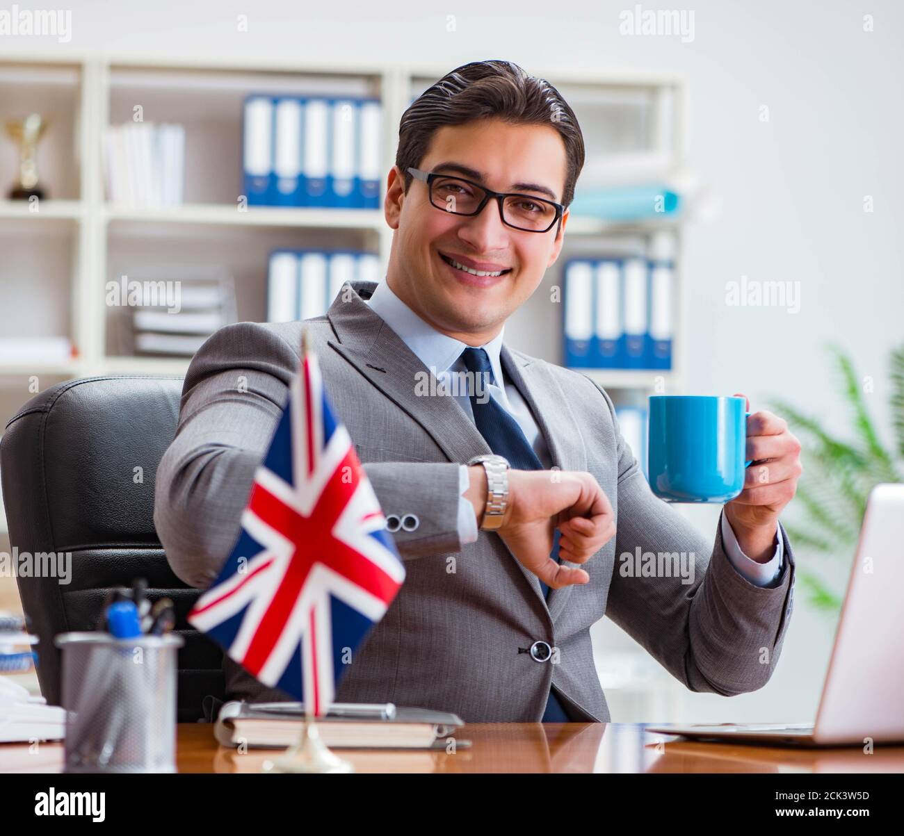 The businessman with british flag in the office Stock Photo - Alamy
