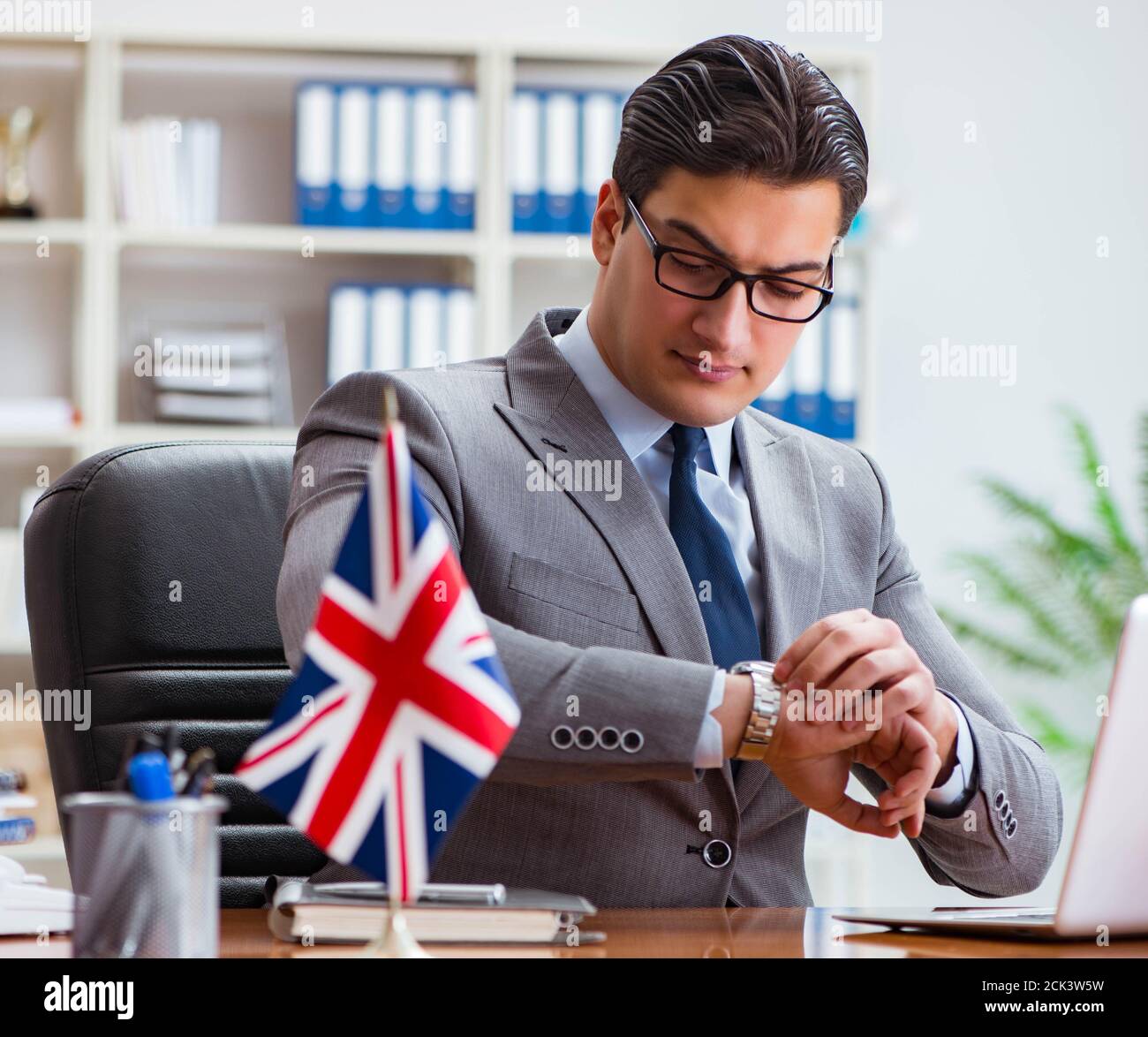 The businessman with british flag in the office Stock Photo - Alamy