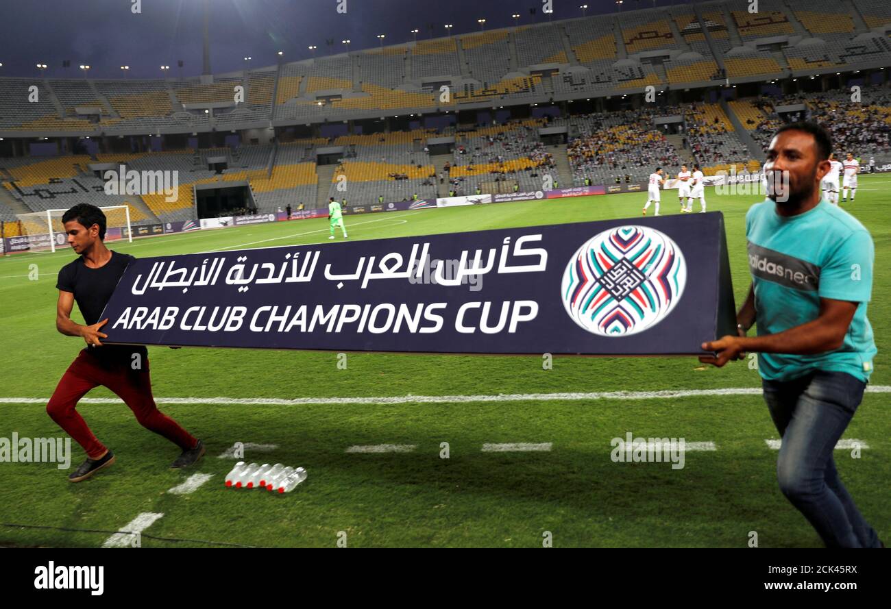 Soccer Football Zamalek V Al Qadsia Arab Club Championship Borg El Arab Stadium Alexandria Egypt August 11 18 Workers Cary Banner Of Arab Club Championship After The Game