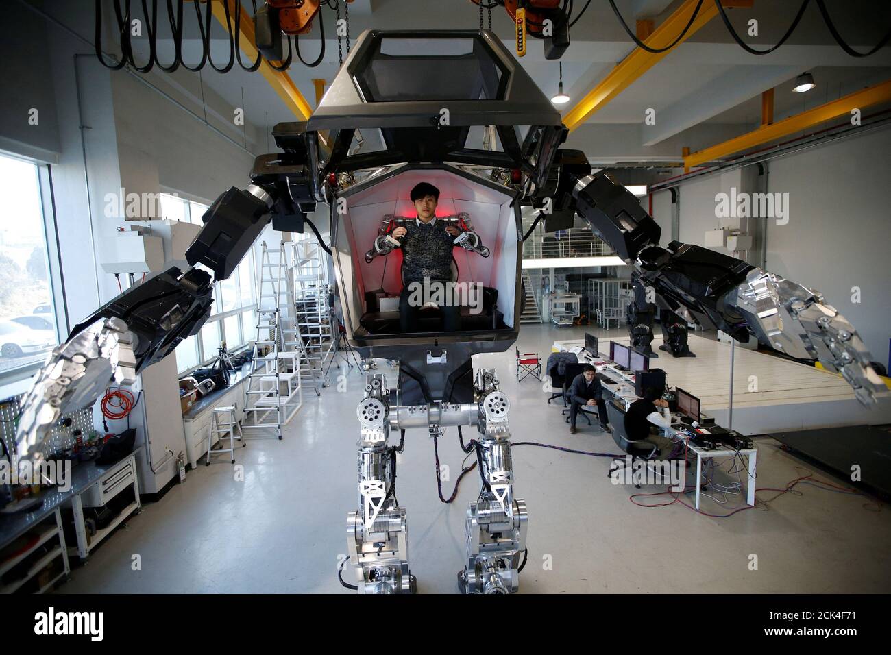 An employee controls the arms of a manned biped walking robot during a demonstration in Gunpo, South Korea, December 27, 2016. Hong-Ji TPX IMAGES OF THE DAY Stock Photo -