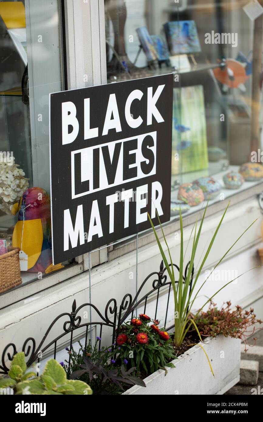 A Black Lives Matter sign in a shop window on Massachusetts Avenue in West Acton, Massachusetts, USA. Stock Photo