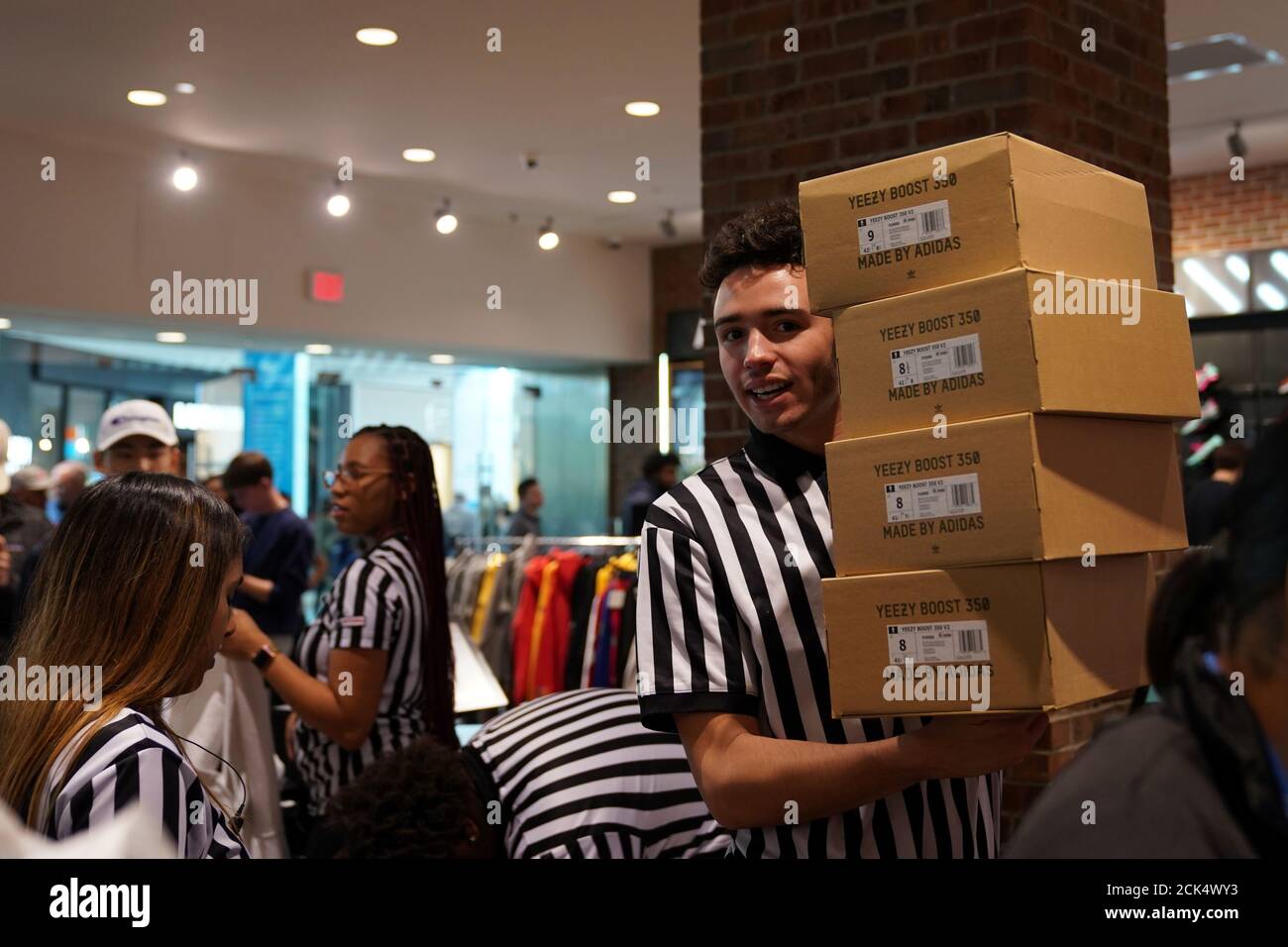 A Foot Locker employee retrieves boxes of Kanye West's Yeezy shoes in King  of Prussia mall on Black Friday, a day that kicks off the holiday shopping  season, in King of Prussia,