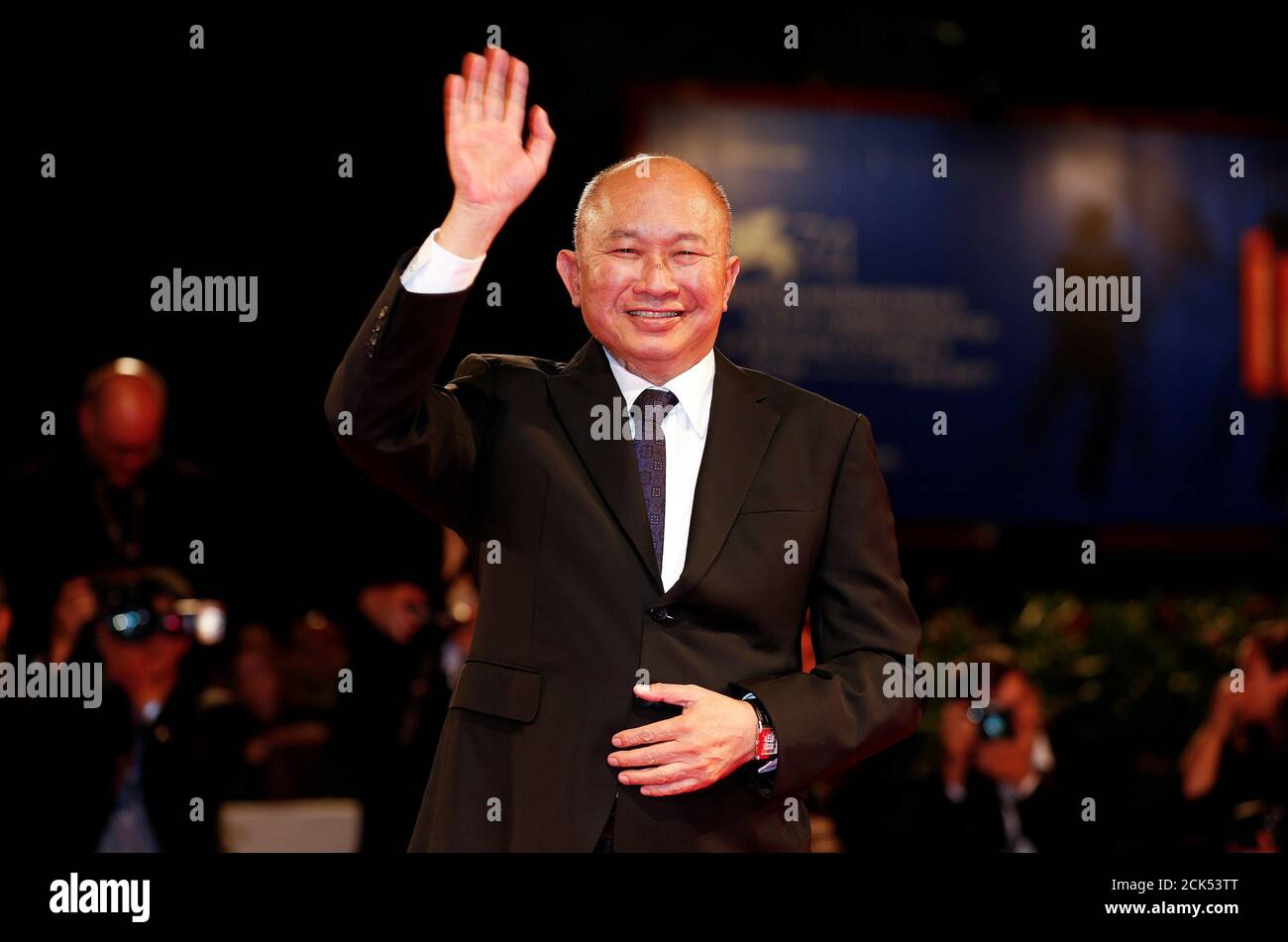 REFILE - CORRECTING TYPO IN FILM NAME:  Director John Woo waves as he arrives during a red carpet event for the movie 'Zhuibu (Manhunt)' at the 74th Venice Film Festival in Venice, Italy, September 8, 2017. REUTERS/Alessandro Bianchi Stock Photo