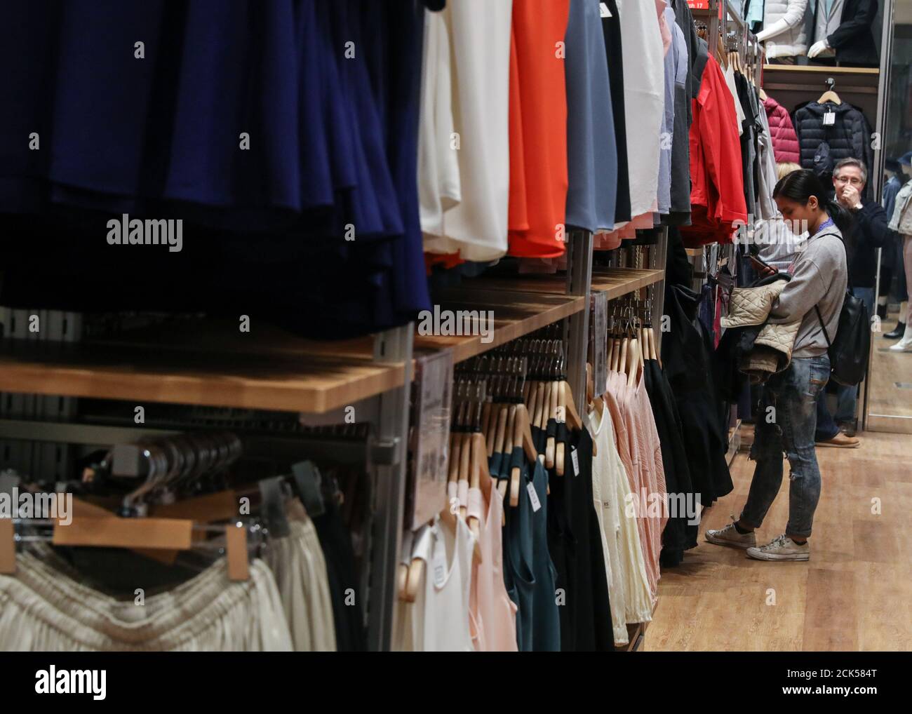People shop at an H&M store during the grand opening of the The Hudson Yards development, a residential, commercial, and retail space on Manhattan's West side in New York City, New York, U.S., March 15, 2019. REUTERS/Brendan McDermid Stock Photo