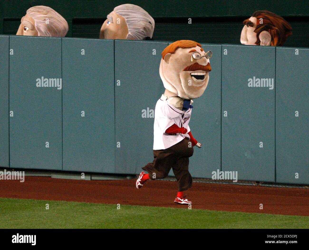 The Teddy Roosevelt mascot (foreground) takes an early lead over Jefferson  (back, l-r), Washington and Lincoln in the nightly Presidents Race during  the fourth inning of the MLB National League baseball game