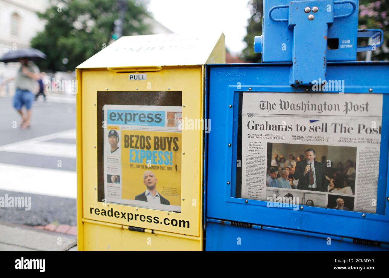 Copies of sister publications Express and the Washington Post trumpet their  sale to Amazon.com Inc founder Jeff Bezos, in Washington, August 6, 2013.  Amazon.com Inc founder Jeff Bezos will buy the Washington