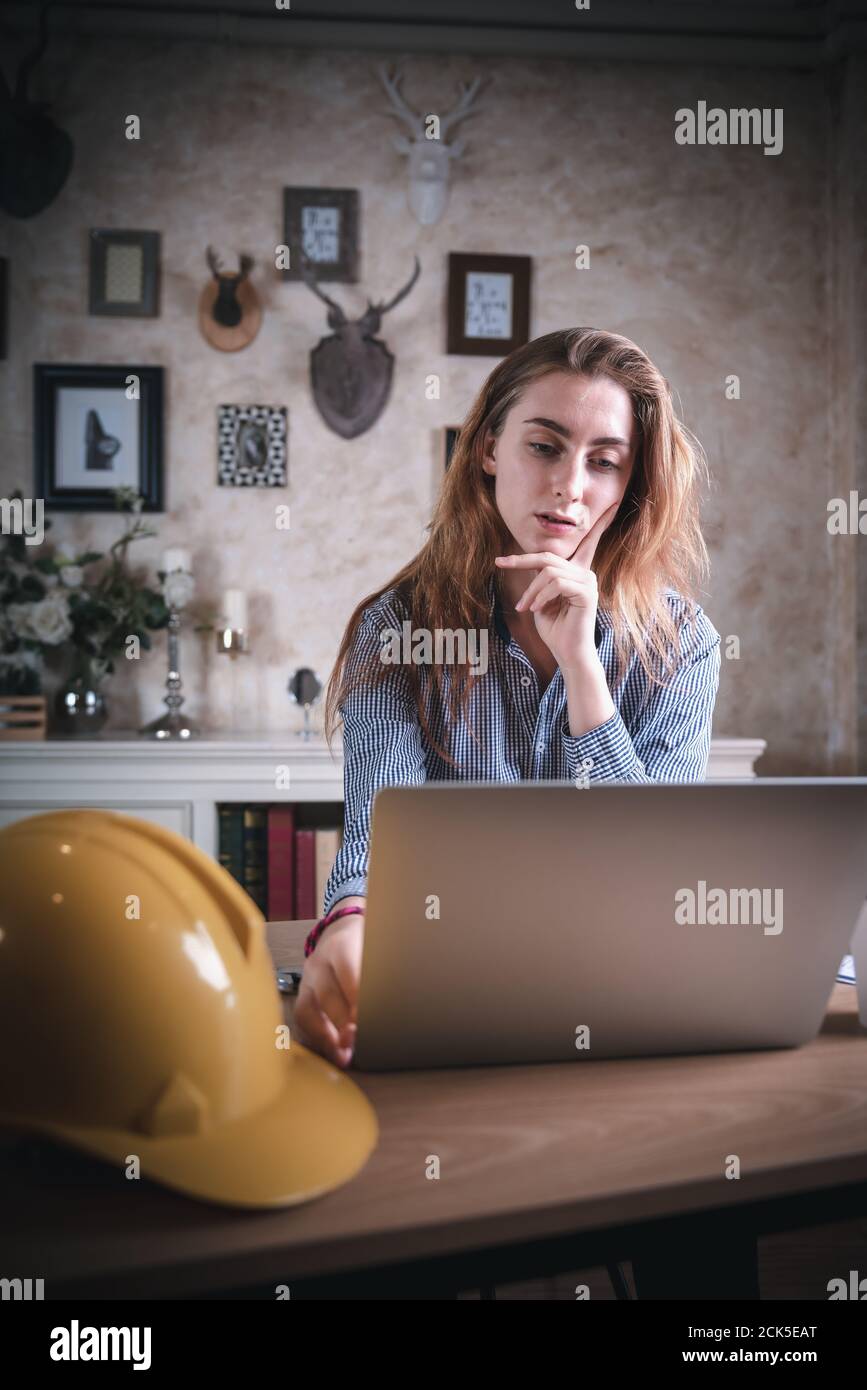 Architect Design is Working in Home Workplace While Thinking Creative  Architecture Drawing on Laptop, Home Creativity Interior Designer is Using Comp Stock Photo