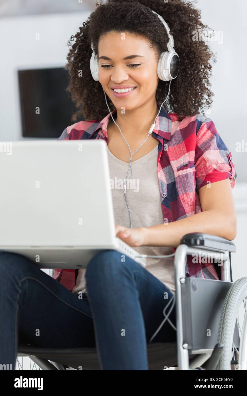 disabled woman in wheelchair with laptop Stock Photo - Alamy