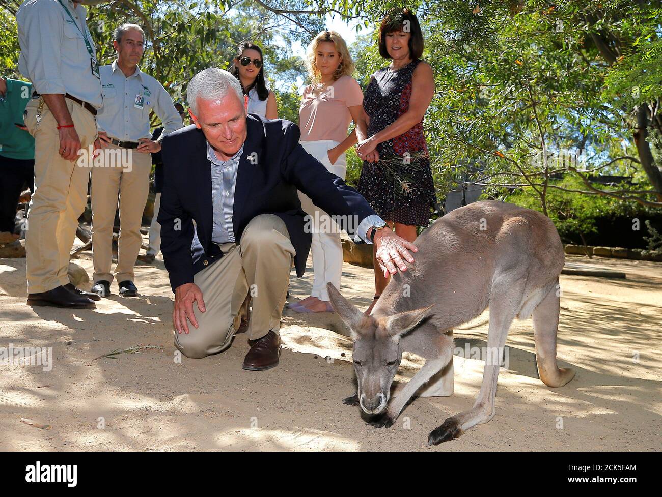 U.S. Vice President Mike Pence pats a kangaroo called Penny as he visits Taronga Zoo with wife Karen and daughters Charlotte and Audrey in Sydney, Australia, April 23, 2017. REUTERS/Jason Reed Stock Photo