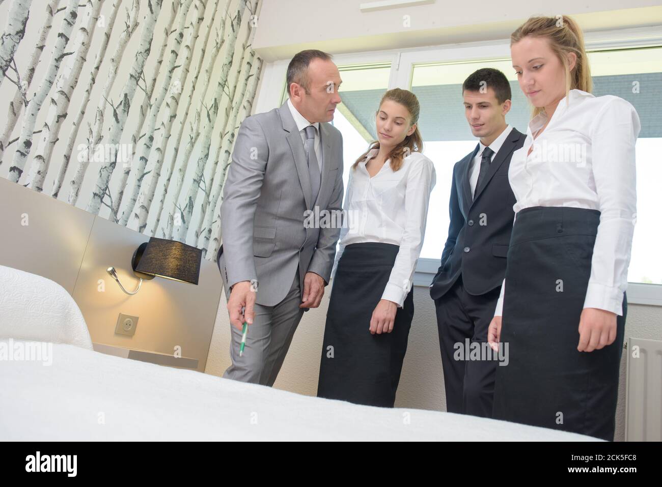 A Supervisor With Hotel Staff Stock Photo Alamy   A Supervisor With Hotel Staff 2CK5FC8 