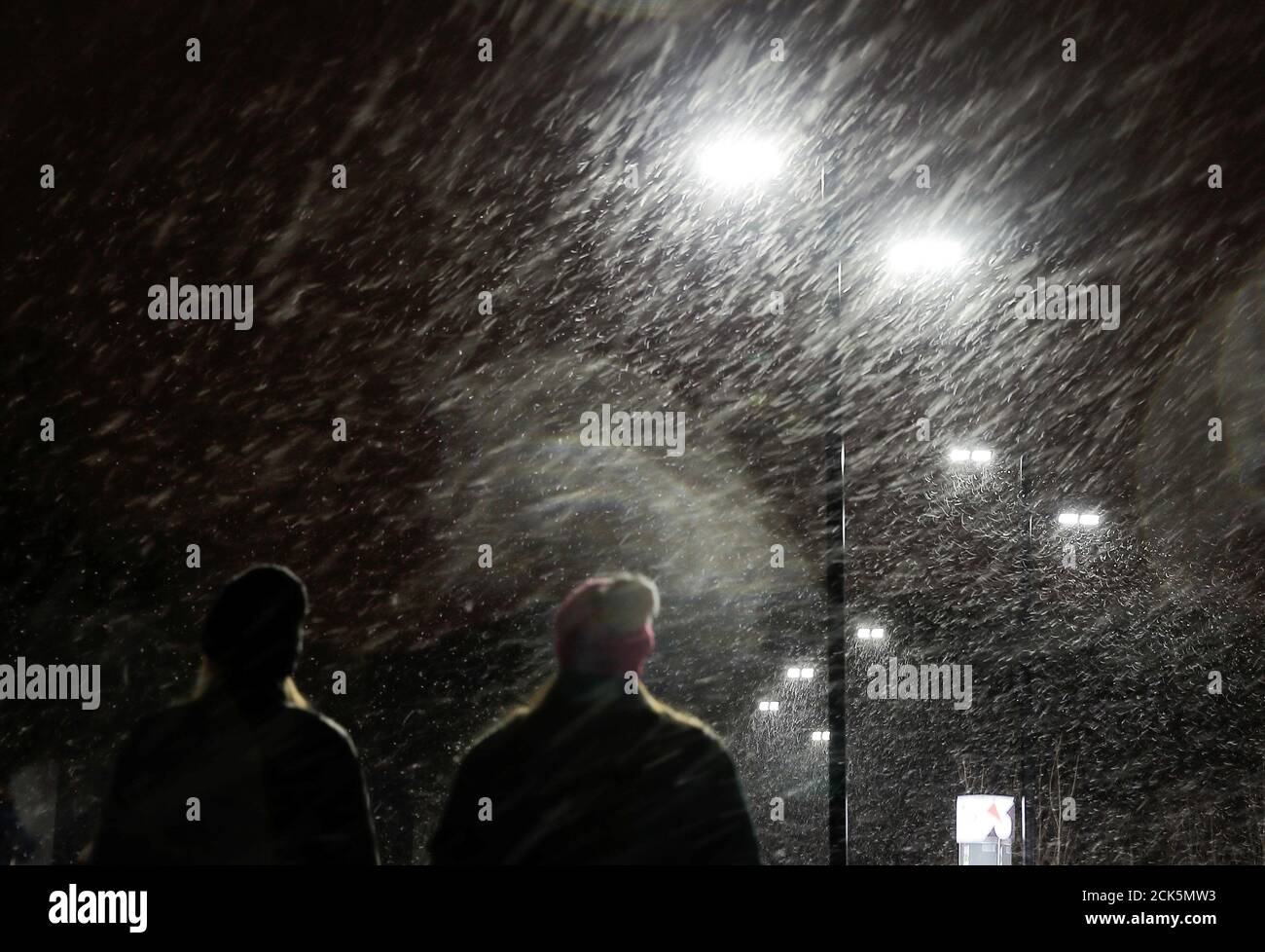A couple walk through a heavy snowfall in Moscow, Russia February 23, 2019. REUTERS/Maxim Shemetov Stock Photo
