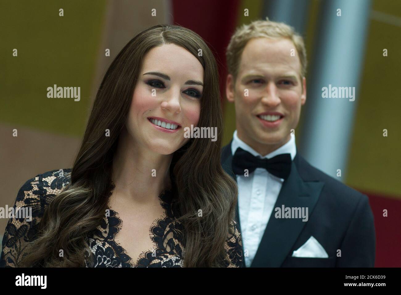 Wax figures of Kate Middleton, Duchess of Cambridge, and Prince William are on display during a media reception at the British embassy in Berlin, August 16, 2012. After the one-day stop-over at the embassy, the wax figures will be on display for 12 weeks at the Madame Tussauds in Berlin.  REUTERS/Thomas Peter (GERMANY - Tags: SOCIETY ENTERTAINMENT ROYALS) Stock Photo