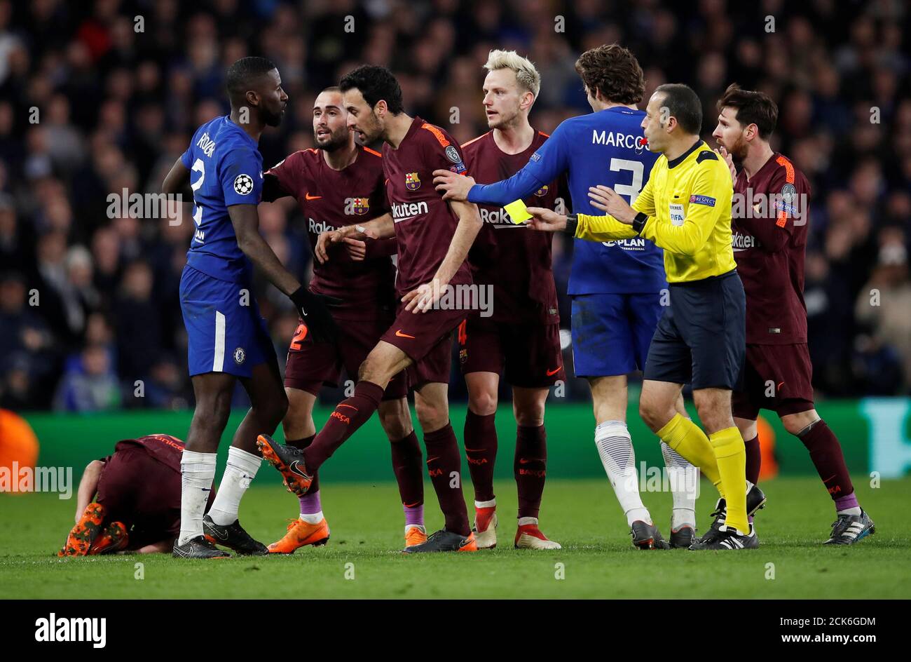 Soccer Football - Champions League Round of 16 First Leg - Chelsea vs FC Barcelona - Stamford Bridge, London, Britain - February 20, 2018   Chelsea's Antonio Rudiger is shown a yellow card by referee Cuneyt Cakir for a foul on Barcelona’s Sergi Roberto   REUTERS/Eddie Keogh Stock Photo