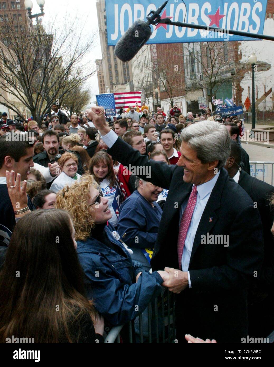 U.S. Presidential candidate John Kerry greets supporters gathered in the middle of Federal Street for a 'Jobs Tour' rally in Youngstown, Ohio, April 27, 2004. Kerry is campaigning in Ohio as he continues his three-day bus trip through the states of West Virginia, Pennsylvania, Ohio and Michigan. REUTERS/Jim Bourg US ELECTION  JRB Stock Photo