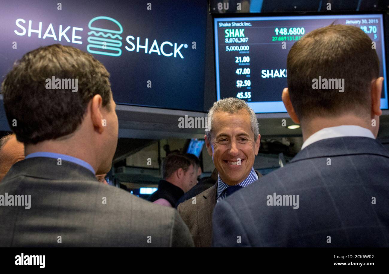 Shake Shack founder Danny Meyer celebrates his company's IPO on the floor of the New York Stock Exchange January 30, 2015. Shares of gourmet hamburger chain Shake Shack Inc soared 150 percent in their first few minutes of trading on Friday, valuing the company that grew out of a hotdog cart in New York's Madison Square Park at nearly $2 billion. REUTERS/Brendan McDermid (UNITED STATES - Tags: BUSINESS FOOD) Stock Photo