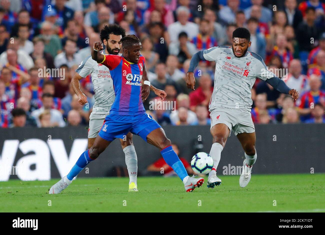 Soccer Football - Premier League - Crystal Palace v Liverpool - Selhurst Park, London, Britain - August 20, 2018 Crystal Palace's Wilfried Zaha in action with Liverpool's Joe Gomez REUTERS/Eddie Keogh EDITORIAL USE ONLY. No use with unauthorized audio, video, data, fixture lists, club/league logos or "live" services. Online in-match use limited to 75 images, no video emulation. No use in betting, games or single club/league/player publications. Please contact your account representative for further details. Stock Photo