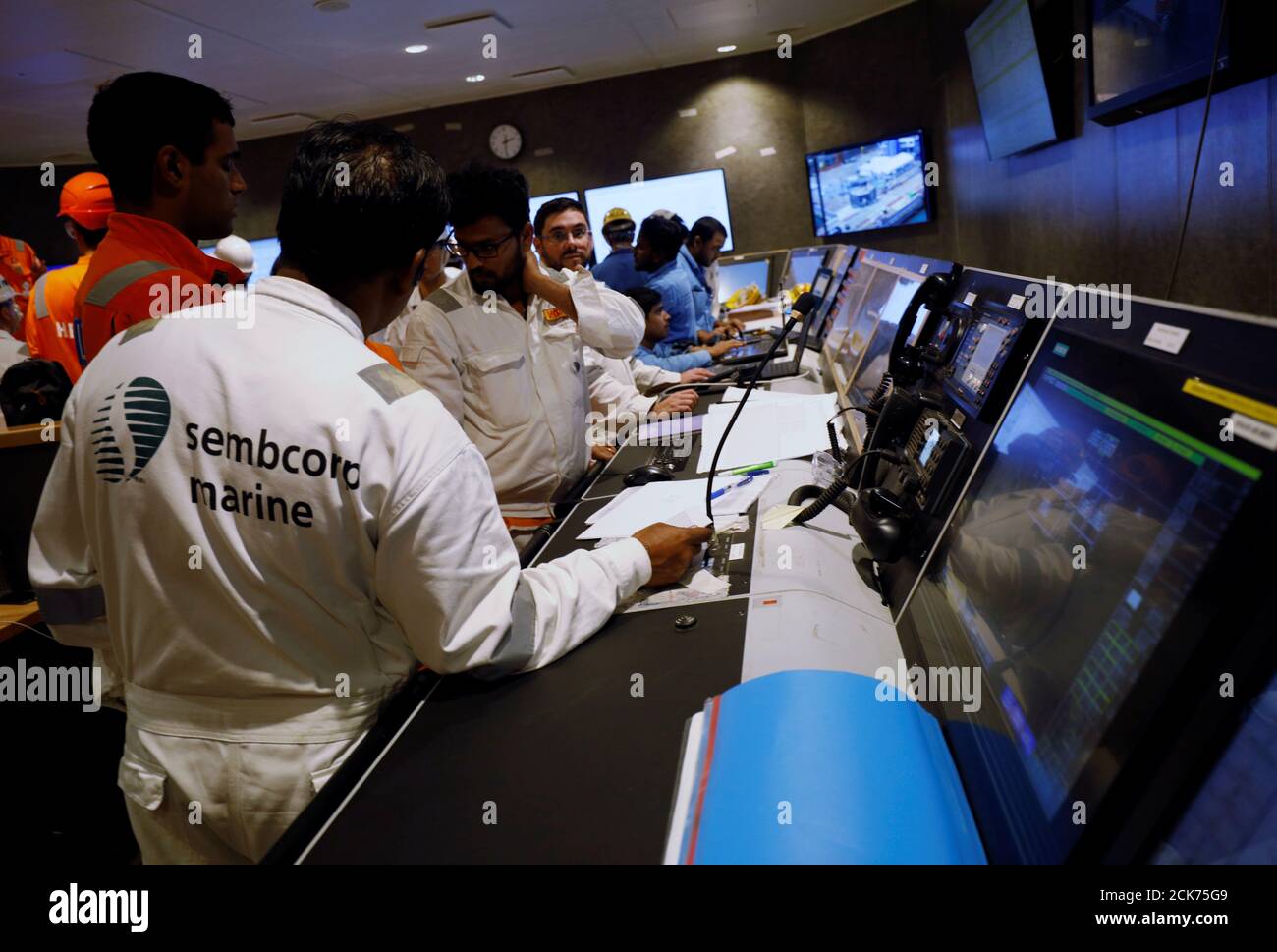 Engineers work onboard the Heerema Marine Contractors' Sleipnir, the