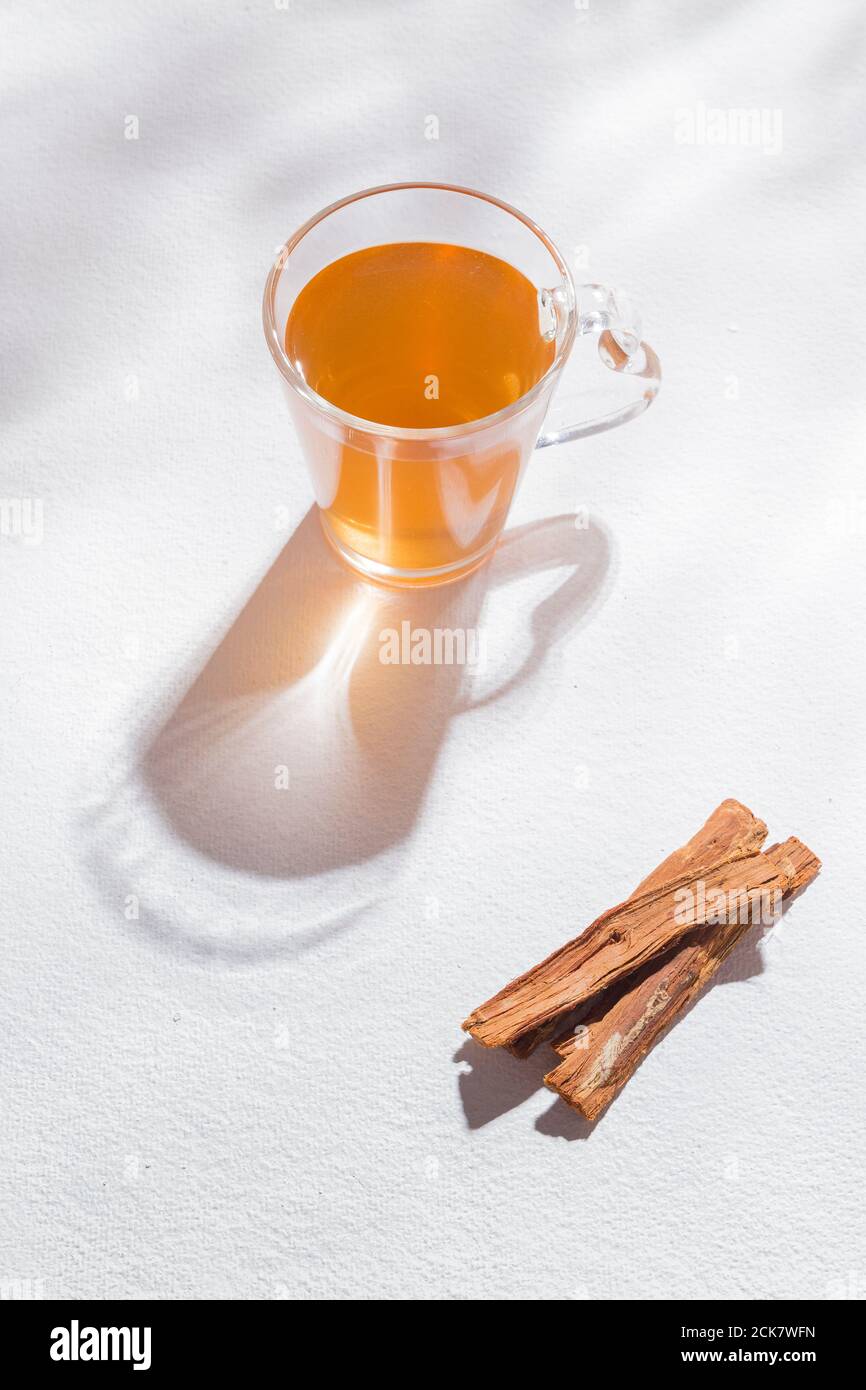 Bark and tea of cat's claw plant on white background Uncaria