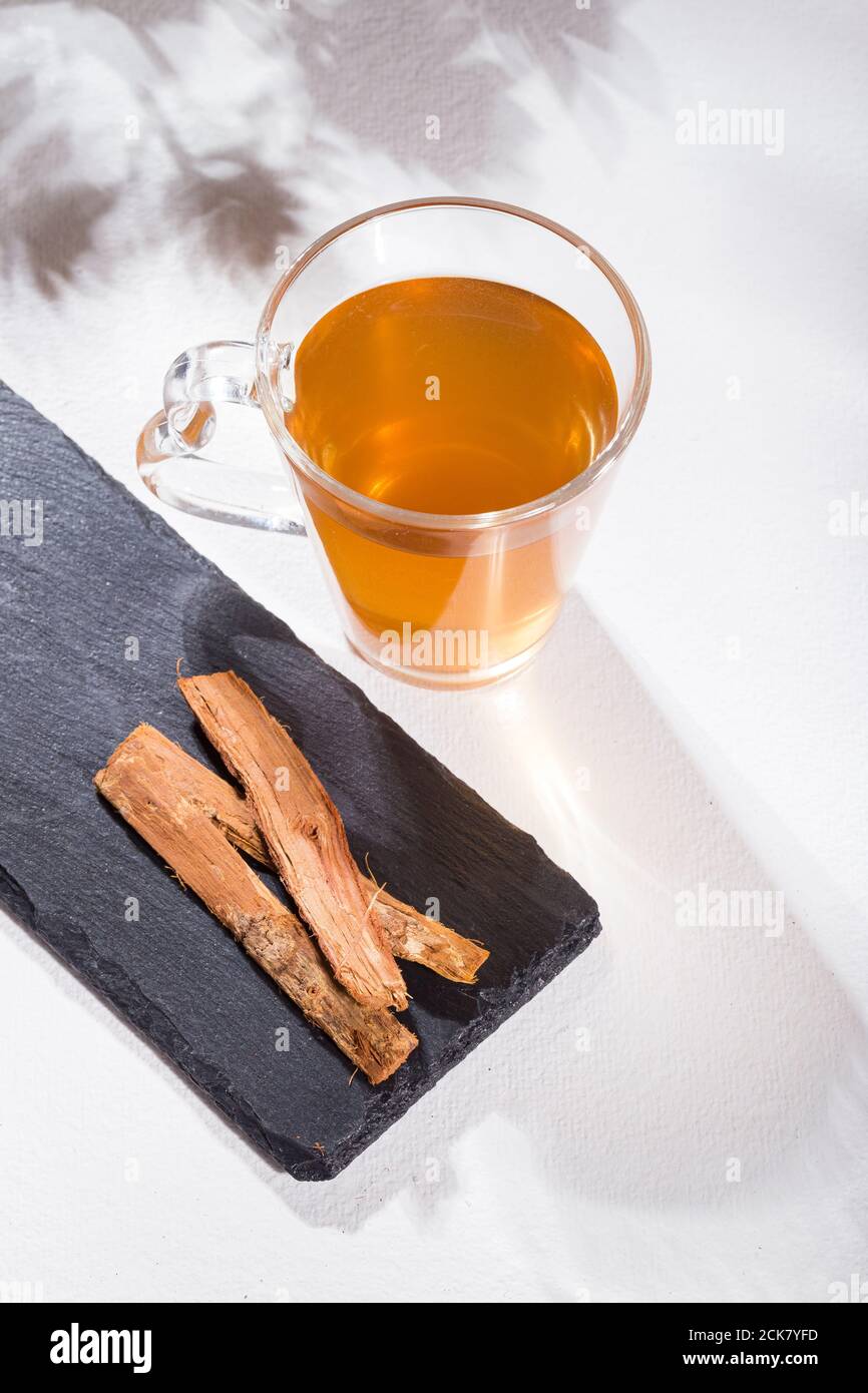 Bark and tea of cat's claw plant on white background Uncaria